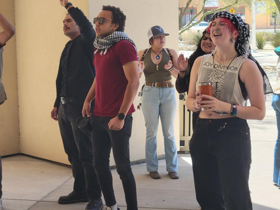 Protesters in favor of a ceasefire in the latest Israel-Hamas war react at Las Cruces City Hall after City Council removed a resolution from Monday's agenda that, if passed, would have called for a permanent ceasefire.