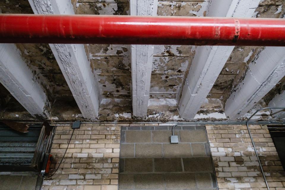 The crumbling ceiling in the basement of Central Elementary in New Philadelphia is one of many reasons the district is looking to construct new buildings