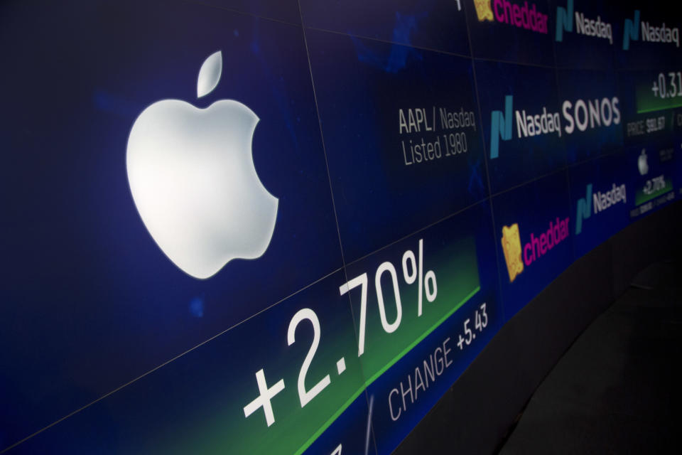 An electronic screen displays Apple stock at the Nasdaq MarketSite in New York. Microsoft is threatening to overtake Apple as the world’s most valuable publicly traded company. AP Photo/Mark Lennihan, File)