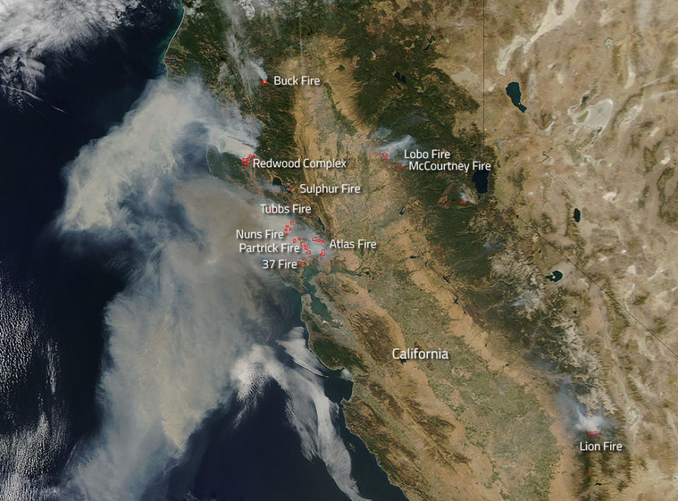 <p>Fires broke out quickly this past weekend in northern California. NASA’s Aqua satellite collected this natural-color image with the Moderate Resolution Imaging Spectroradiometer, MODIS, instrument on Oct. 9, 2017. Actively burning areas (hot spots), detected by MODIS’s thermal bands, are outlined in red. Each hot spot is an area where the thermal detectors on the MODIS instrument recognized temperatures higher than background. When accompanied by plumes of smoke, as in this image, such hot spots are diagnostic for fire. (Photo: NASA/Jeff Schmaltz LANCE/EOSDIS MODIS Rapid Response Team, GSFC) </p>