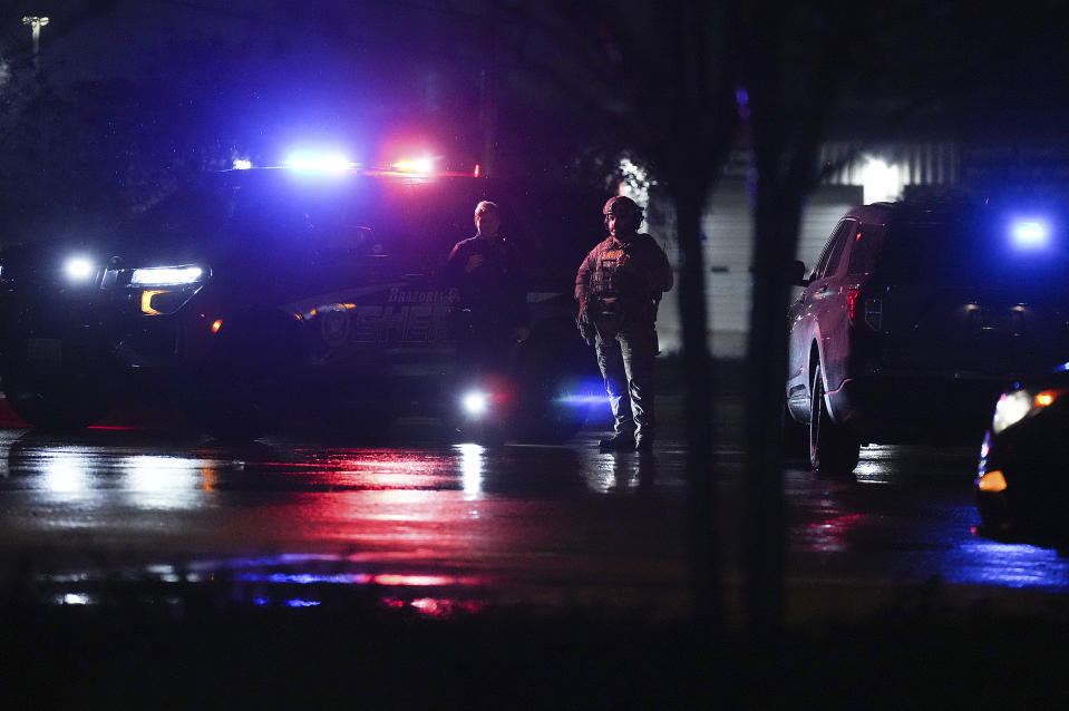 Members of Brazoria County Sheriff's Department block the road leading to Cole's Antique Village and Flea Market after a shooting outside, Sunday, Nov. 12, 2023, in Pearland, Texas, near Houston. (Elizabeth Conley/Houston Chronicle via AP)