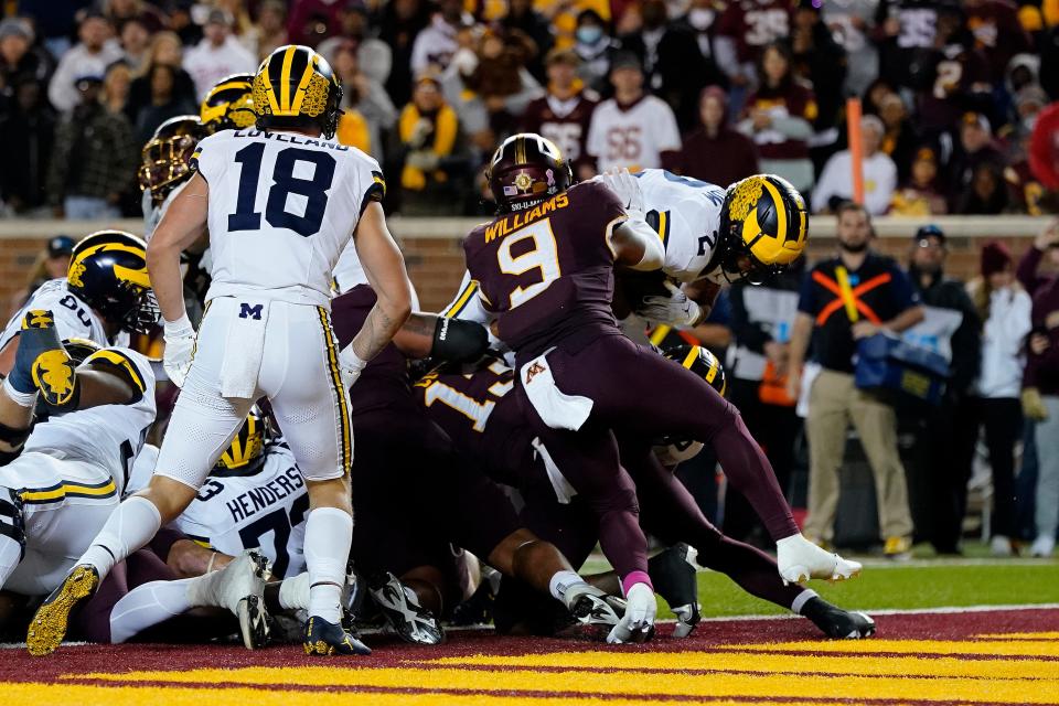 Michigan running back Blake Corum (2) scores a rushing touchdown during the first half against Minnesota at Huntington Bank Stadium in Minneapolis on Saturday, Oct. 7, 2023.