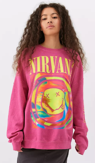 model wearing baggy pink Nirvana pullover