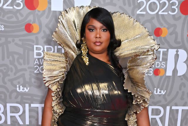 <p>David M. Benett/Dave Benett/Getty</p> Lizzo at the 2023 BRIT Awards