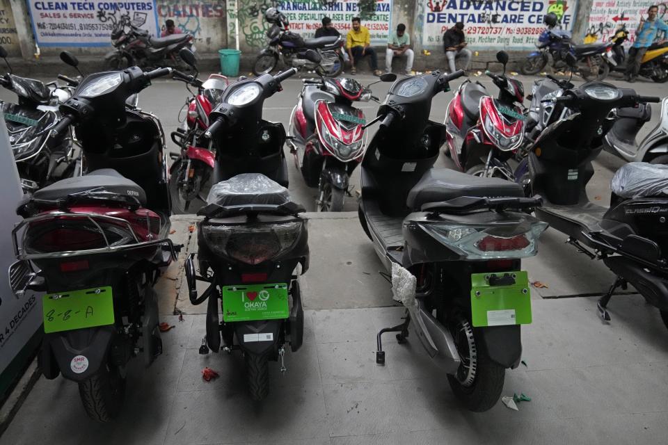 Electric two-wheelers are displayed for sale outside a store in Bengaluru, India, Monday, Aug. 28, 2023. India is one of the fastest growing electric vehicle markets in the world.(AP Photo/Aijaz Rahi)