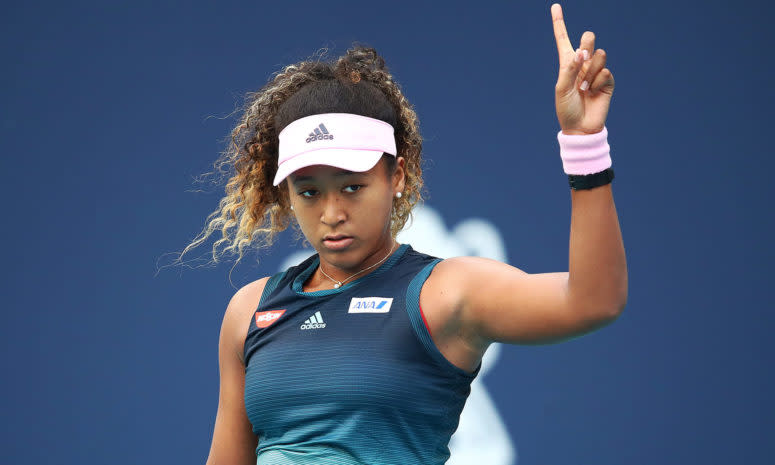 Naomi Osaka playing tennis.