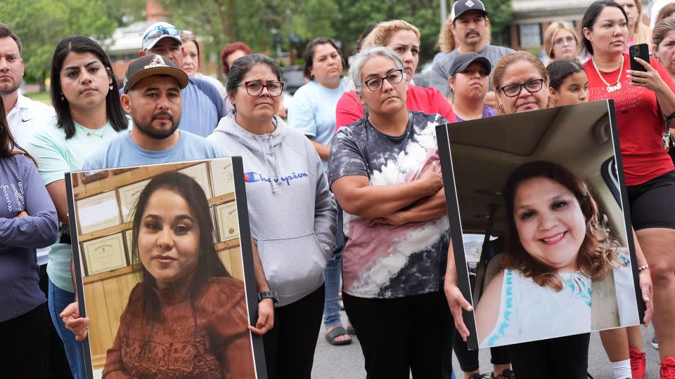 Francesco Guerrero brought a photograph of his wife and Guadalupe Hernandez shows a photograph of her sister during a news conference for the victims and the missing in Erwin, Tennessee, on Sunday. - Saul Young/News Sentinel/USA Today Network/Imagn Images