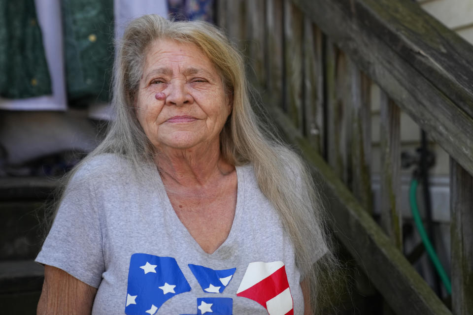 Lanette Clendaniel, mother of Sarah Beth Clendaniel, poses for a photograph for The Associated Press outside her home, Wednesday, Feb. 8, 2023, in North East, Md. U.S. Attorneys for Maryland announced the arrests and a federal criminal complaint charging Sarah Beth Clendaniel, of Catonsville, and Brandon Clint Russell, of Orlando, with conspiracy to destroy an energy facility. (AP Photo/Julio Cortez)