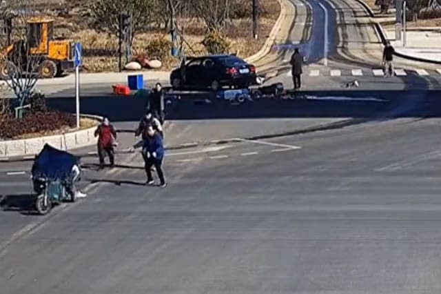 Out-of-control three-wheeler does doughnuts on road after being hit by car in China