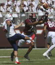 Virginia Tech defensive back Jalen Stroman (26) rushes a punt by Richmond's Aaron Trusler (36) in the first half of the Richmond Virginia Tech NCAA college football game in Blacksburg, Va., Saturday, Sept. 25 2021. (Matt Gentry/The Roanoke Times via AP)