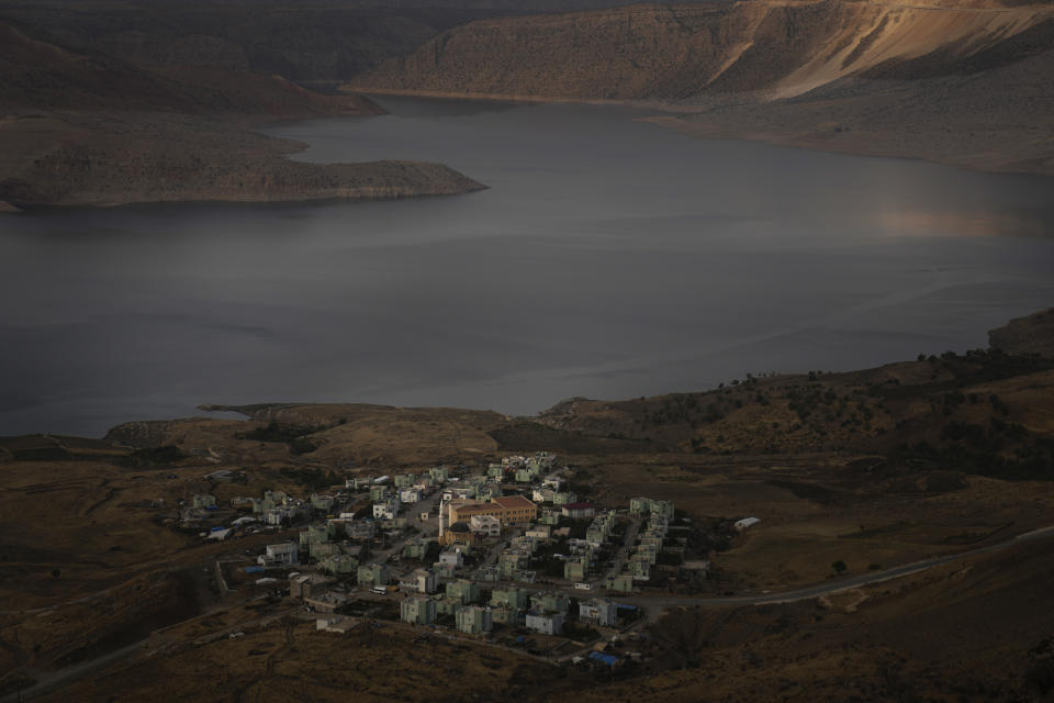 A general view of the Ilisu Dam reservoir is seen in Mardin province, Turkey, Tuesday, Oct. 18, 2022. Before Turkey began operating the dam in May 2020, all the waters of Tigris River flowed into Iraq. Now how much water comes down depends on Ankara's consideration of Iraq's month-to-month requests for a minimum flow, weighed against Turkey's own needs. (AP Photo/Khalil Hamra)