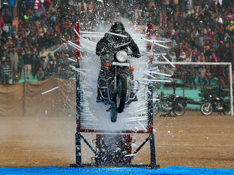 motorcycle stunt busting through