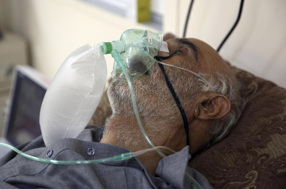 A patient is connected to oxygen tank in the Intensive Care Unit ward for COVID-19 patients at the Afghan-Japan Communicable Disease Hospital in Kabul, Afghanistan, Tuesday June 30, 2020. (AP Photo/Rahmat Gul)