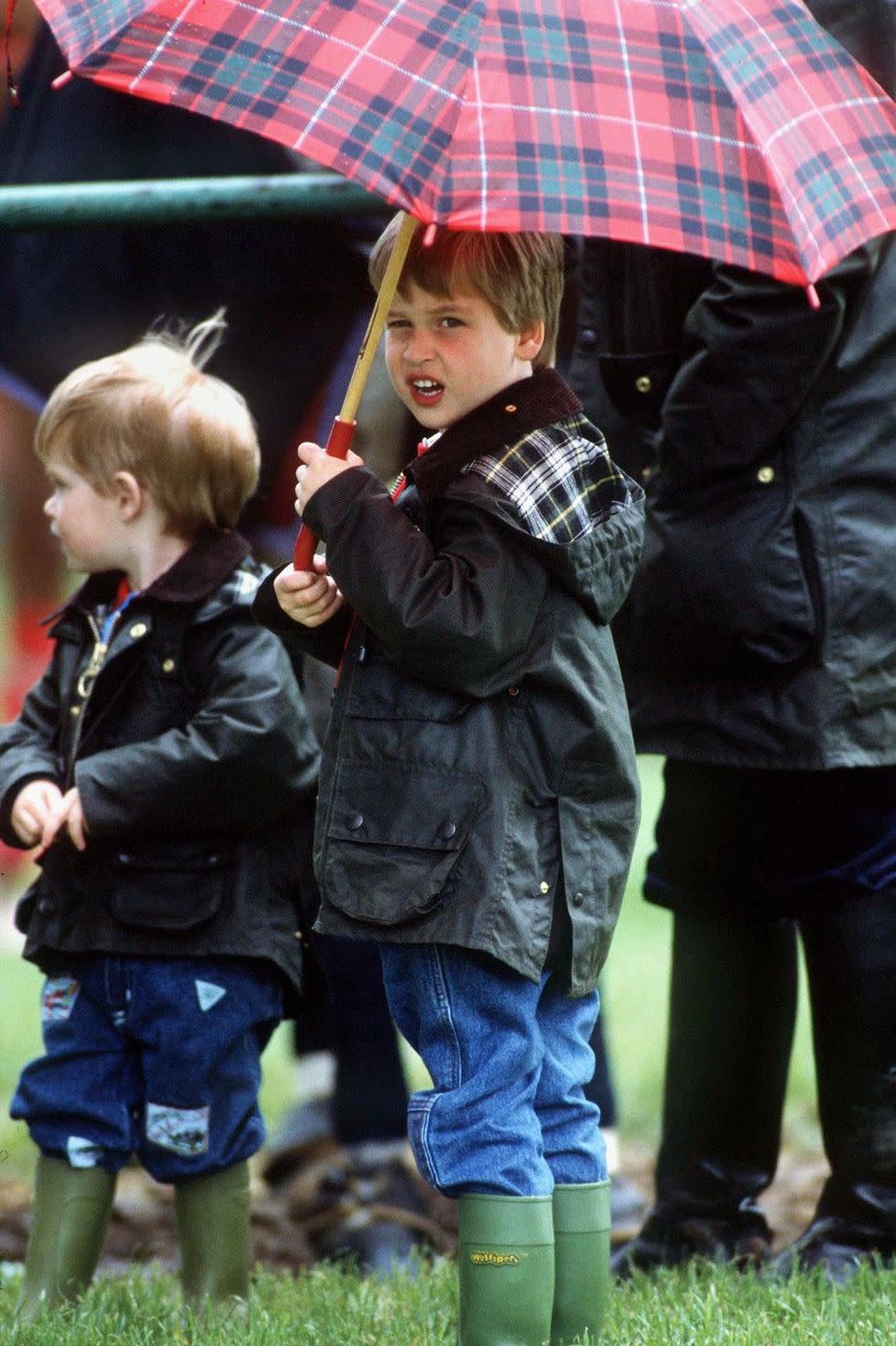 <p>A young Prince William shields himself and his brother during a polo match.<br></p>