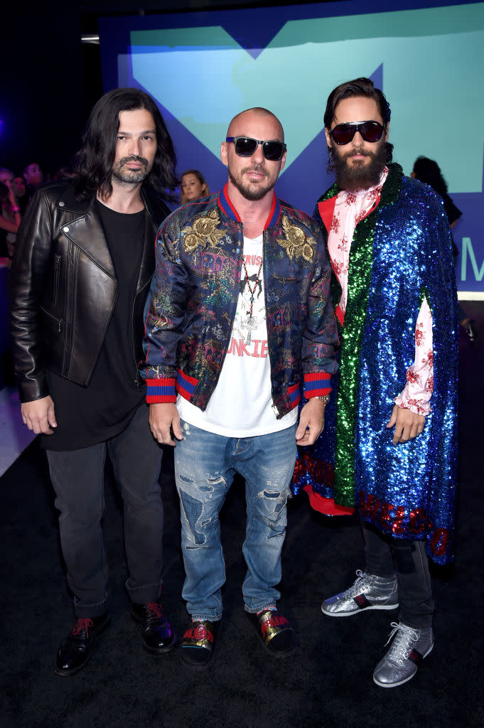 <p>Jared Leto wore a sequin Gucci cape with his Thirty Seconds to Mars bandmates. (Photo: Getty Images) </p>