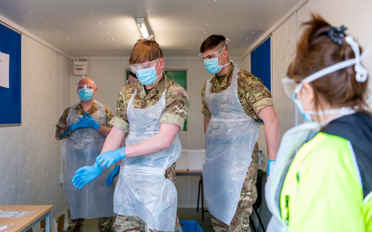 Scottish soldiers prepare to test NHS workers for Covid at a testing facility in Glasgow Airport last year. It is understood that Nicola Sturgeon wants a similar arrangement to ease the pressure on paramedics - Ministry of Defence/Cpl Nathan Tanuku/Crown Copyright 2020/Handout via Reuters