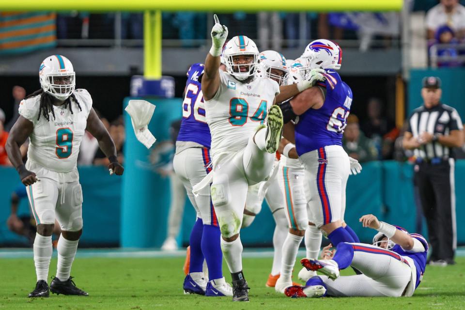 Miami Dolphins defensive tackle Christian Wilkins (94) celebrates a sack during an NFL football game against the Buffalo Bills, Sunday, Jan. 7, 2024, in Miami Gardens, Fla. The Bills defeated the Dolphins 21-14. (AP Photo/Gary McCullough)