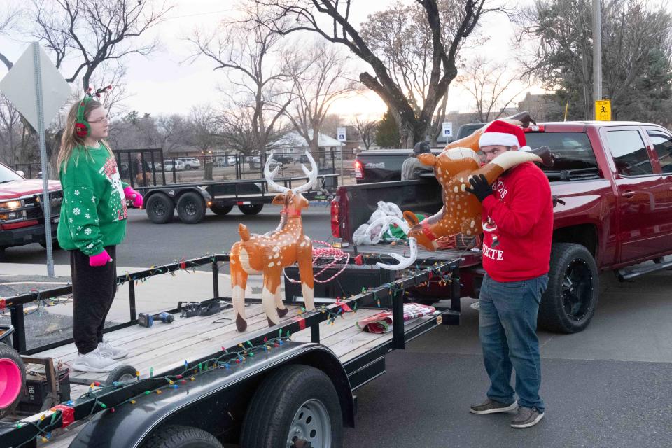 A float is having its final touches put together for the Parade of Lights Saturday in Canyon , Texas.