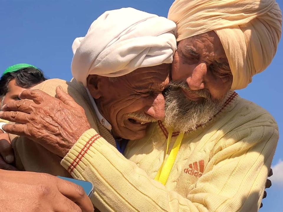 Earlier this year, a video Sikka Khan, left, and his older brother Sadiq, right, reuniting after being separated in India's partition in August 1947 went viral. Social media has helped separated relatives like them find each other decades after the division of India and Pakistan wrenched them apart. (Punjabi Lehar - image credit)