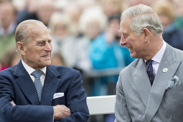 Mark Cuthbert/UK Press via Getty Images Prince Philip (left) and his son Charles