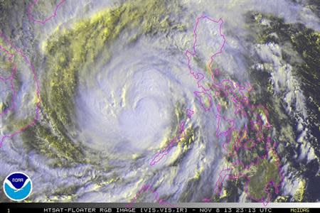 Typhoon Haiyan is pictured in this NOAA satellite handout image over the Philippines taken November 8, 2013 at 23:13 UTC. REUTERS/NOAA/Handout via Reuters