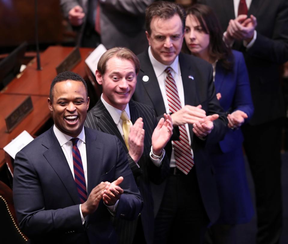 (L-R). State officials, including Attorney General Daniel Cameron, Secretary of State Michael Adams, State Auditor Mike Harmon and Treasurer Allison Ball applaud as Gov. Andy Beshear entered the House before delivering his State of the Budget address at the State Capitol building in Frankfort, Ky. on Jan. 28, 2020.  