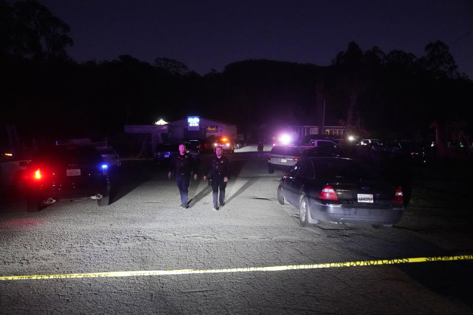 Law enforcement personnel control the scene of a shooting Monday, Jan. 23, 2023, in Half Moon Bay, Calif. Multiple people were killed in two related shootings Monday at a mushroom farm and a trucking firm in a coastal community south of San Francisco, and officials say a suspect is in custody. (AP Photo/Jeff Chiu)