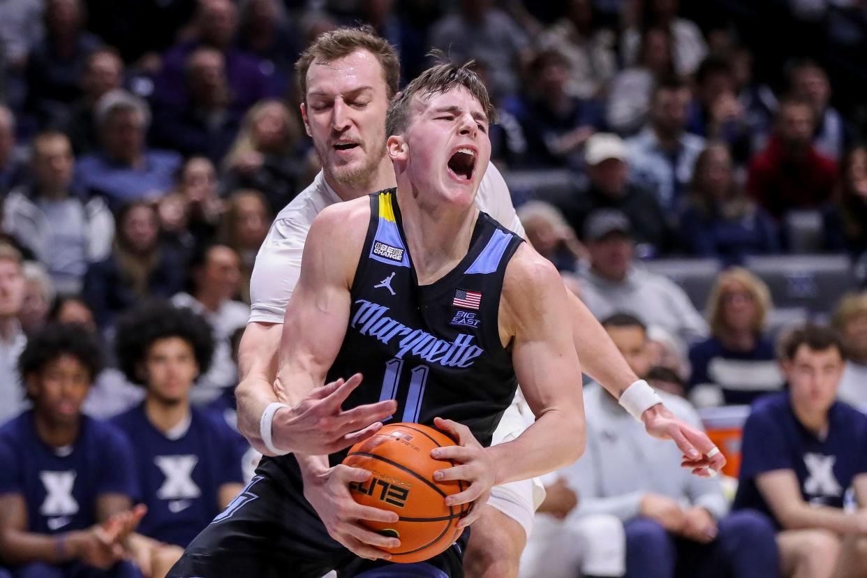 Marquette guard Tyler Kolek drives to the basket against Xavier forward Jack Nunge in the first half Sunday. Kolek scored a game-high 25 points in the Golden Eagles' 80-76 loss to the Musketeers.