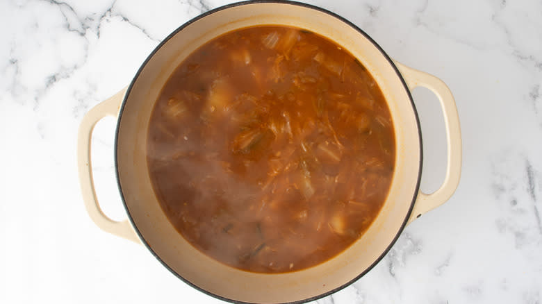 simmering kimchi broth in pot