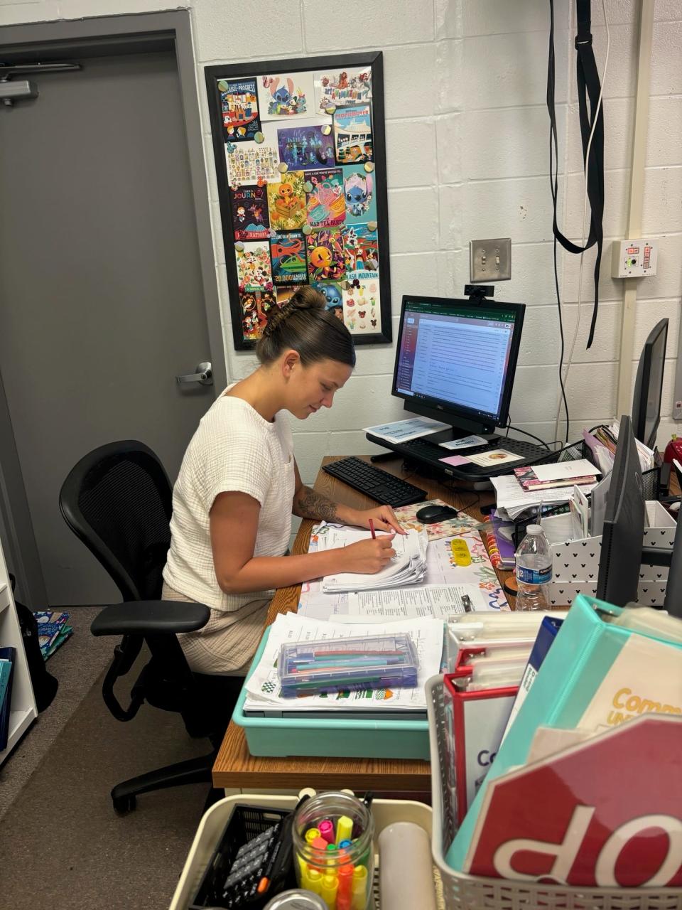 Purdue shooting guard Ella Collier handles paperwork as a substitute teacher at Danville High School on Thursday, May 9, 2024 in Danville, IN