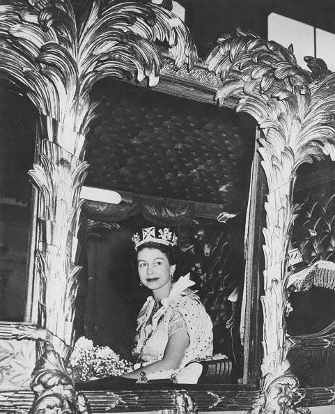 Queen Elizabeth II in a coach.