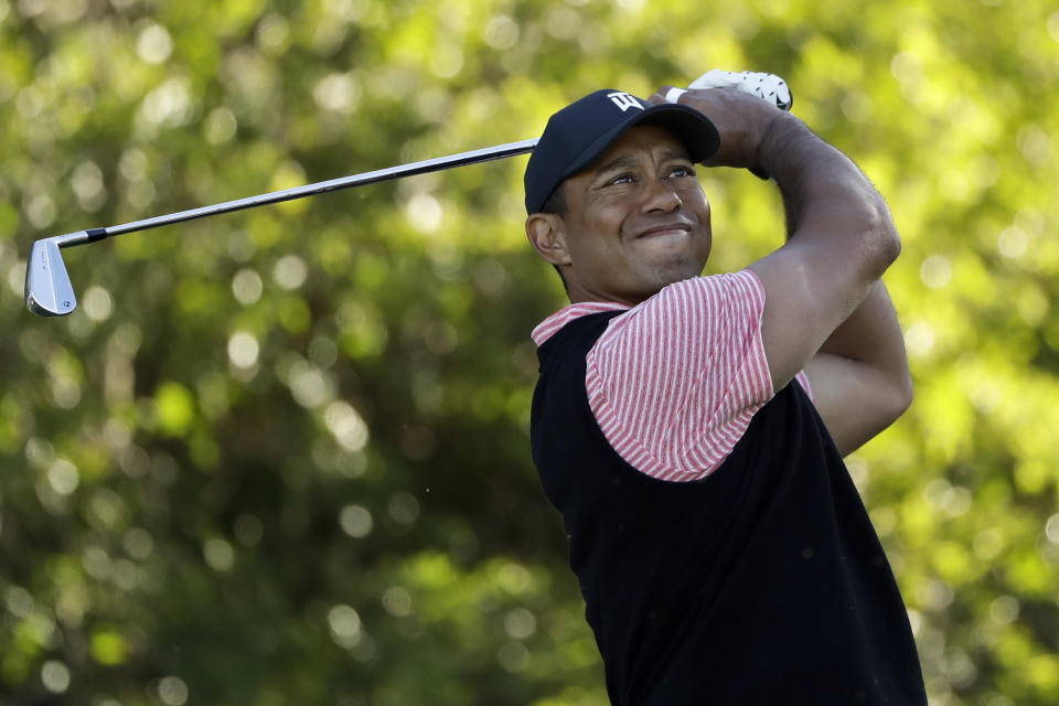 Tiger Woods hits his tee shot on the 11th hole of the South Course at Torrey Pines Golf Course during the final round of the Farmers Insurance golf tournament Sunday, Jan. 27, 2019, in San Diego. (AP Photo/Gregory Bull)