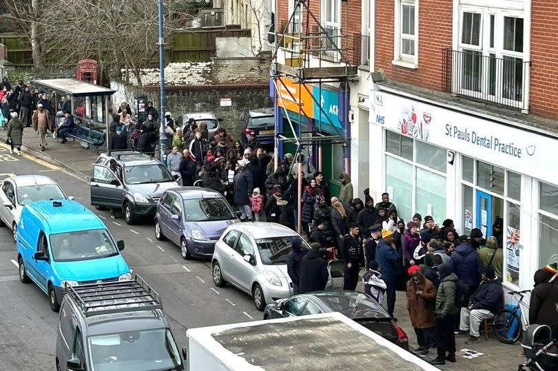 People queued for three days to register as NHS patients when St Pauls Dental practice opened -Credit:AA Access scaffolding