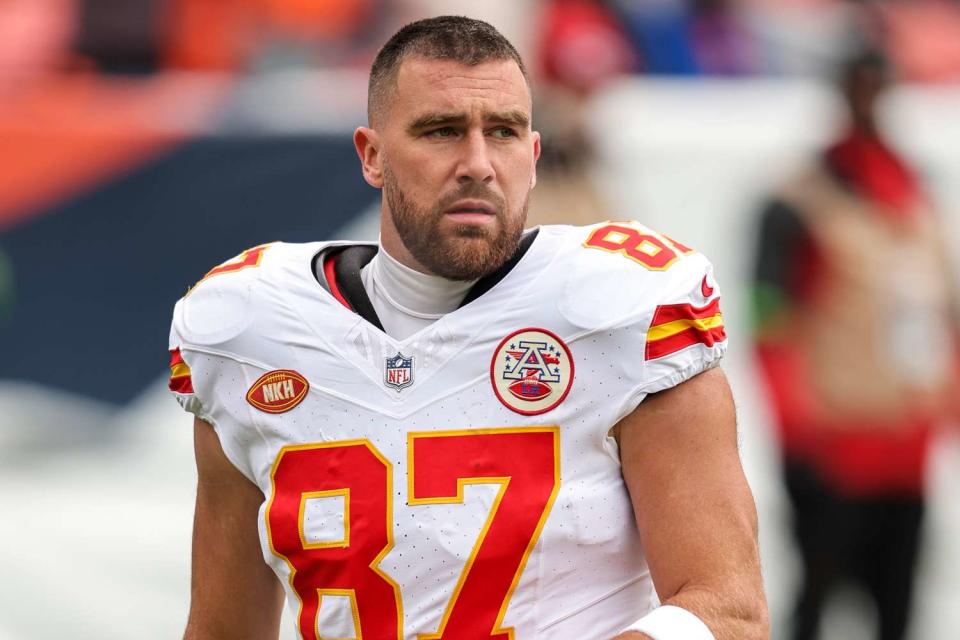 <p>Michael Owens/Getty </p>  Travis Kelce #87 of the Kansas City Chiefs takes a knee with his helmet off prior to an NFL football game between the Denver Broncos and the Kansas City Chiefs at Empower Field At Mile High on October 29, 2023 in Denver, Colorado.