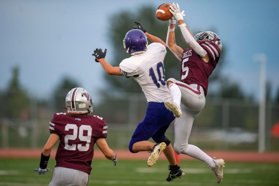 Wellington High School's Cash Altschwager breaks up a pass intended for an Estes Park receiver during their game Friday night at Wellington Middle-High School.