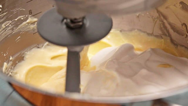 Whipping cream and cream cheese in mixing bowl