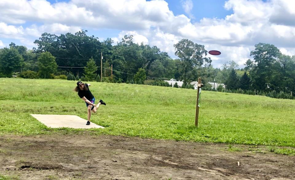 Steve Ives of Holland begins his round at Oakholm Brewing Company's new 18-hole disc golf course.