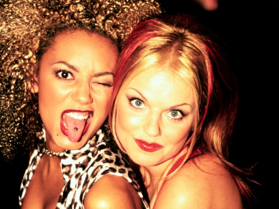 Mel B and Geri Halliwell holding each other