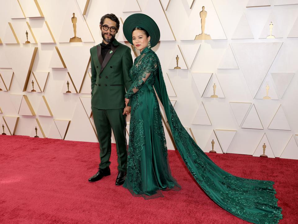 Kelly Marie Tran wears a Thai Nguyen áo dài ensemble to 2022's Academy Awards in Hollywood, California