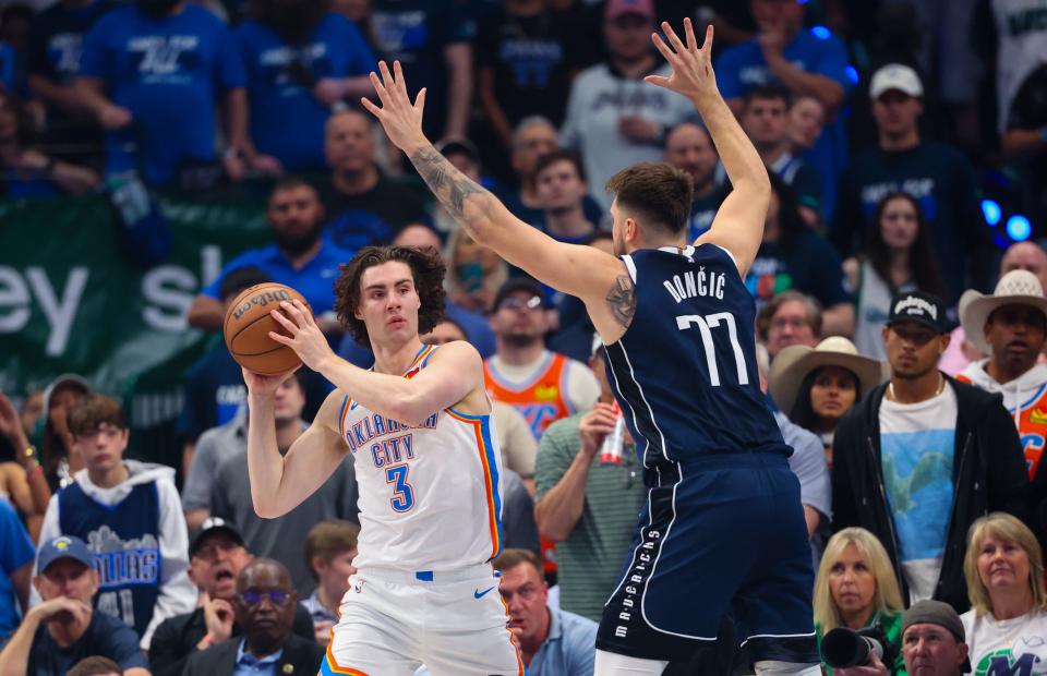 Thunder guard Josh Giddey (3) looks to pass around Mavericks guard Luka Doncic (77) during the first quarter Monday night at American Airlines Center.