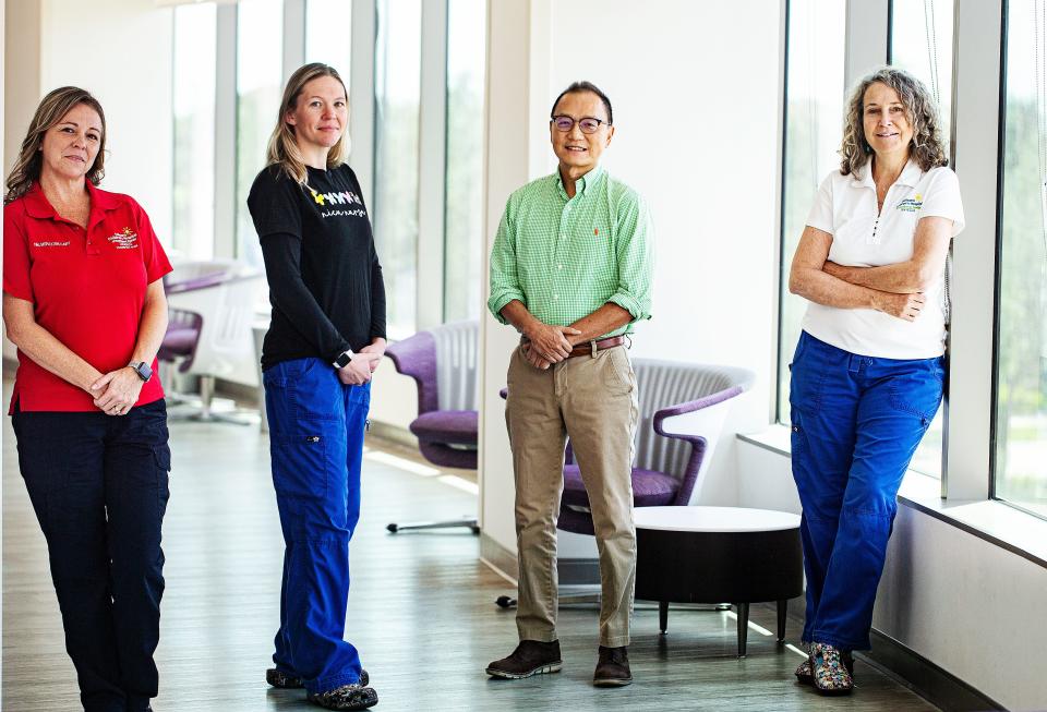 Dr. William Liu, the Medical Director of the Golisano Children's Hospital NICU along with from left, Nichole Shimko, Nurse Manager of the Critical Care Transport Team of Golisano Children's Hospital, Carly Majewski, a Nurse Manager of the Neonatal ICU Golisano Children's Hospital and Nancy Vossler, Nursing Director of the Neonatal ICU at Golisano Children's Hospital and pose for portrait at Golisano Children's Hospital on Tuesday, Sept. 5, 2023. The group helped get babies in the NICU transported to safety during Hurricane Ian last year.