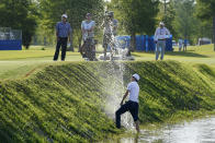 Brandon Hagy hits out of a water hazard on the 17th hole during the second round of the PGA Zurich Classic golf tournament, Friday, April 22, 2022, at TPC Louisiana in Avondale, La. (AP Photo/Gerald Herbert)