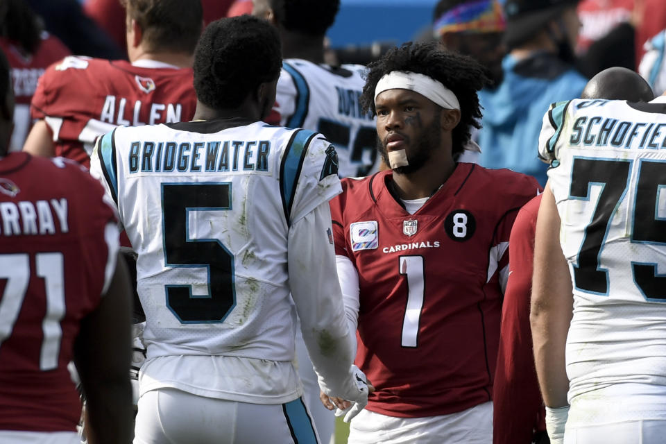 Carolina Panthers quarterback Teddy Bridgewater, left, and Arizona Cardinals quarterback Kyler Murray meet on the field after an NFL football game Sunday, Oct. 4, 2020, in Charlotte, N.C. (AP Photo/Mike McCarn)