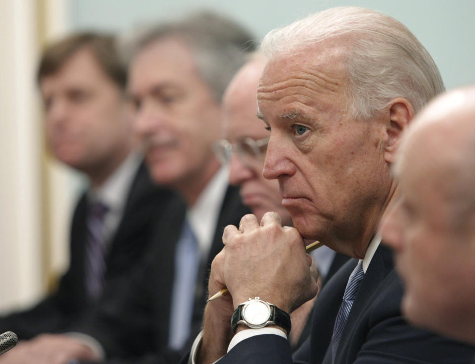 FILE - In this March 10, 2011, file photo, Vice President of the United States Joe Biden, listens to Russian Prime Minister Vladimir Putin, during their meeting in Moscow, Russia. Putin won’t congratulate President-elect Joe Biden until legal challenges to the U.S. election are resolved and the result is official, the Kremlin announced Monday, Nov. 9, 2020. (AP Photo/Alexander Zemlianichenko, File)