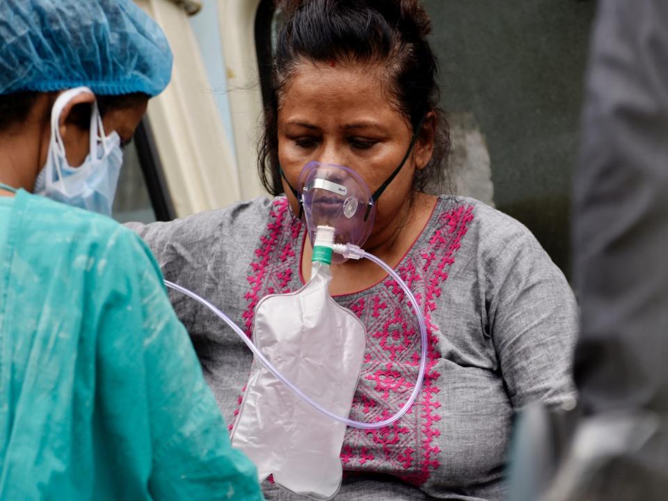 A Covid-19 patient gets admitted to a government hospital in Kolkata, India, 22 April, 2021. India reported 314,835 fresh coronavirus infections on Thursday according to an Indian media report.