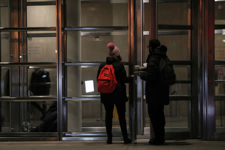 Journalists arrive at the Brooklyn Federal Courthouse for access hours before the trial of Joaquin Guzman, the Mexican drug lord known as "El Chapo", in the Brooklyn borough of New York, U.S., February 11, 2019. REUTERS/Brendan McDermid