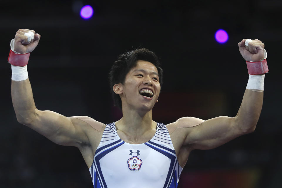 Silver medalist Lee Chih-kai of Taiwan celebrates after his performamce on the pommel horse in the men's apparatus finals at the Gymnastics World Championships in Stuttgart, Germany, Saturday, Oct. 12, 2019. (AP Photo/Matthias Schrader)