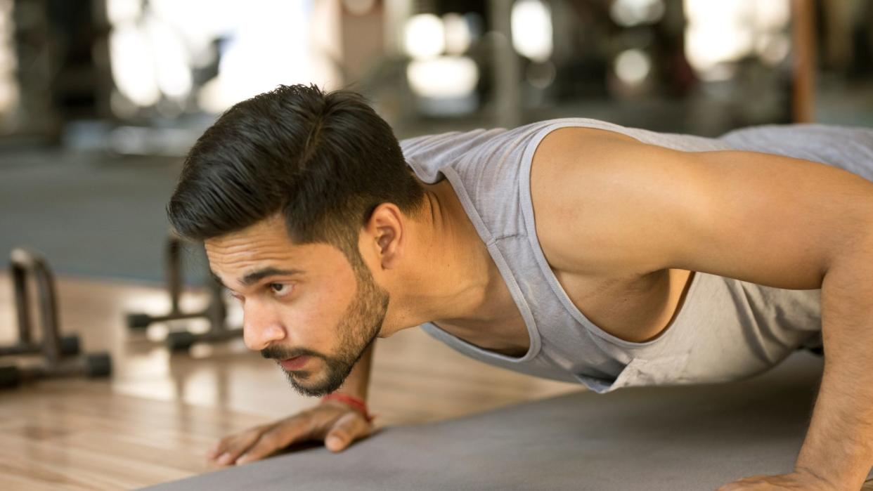  Man performing push ups. 