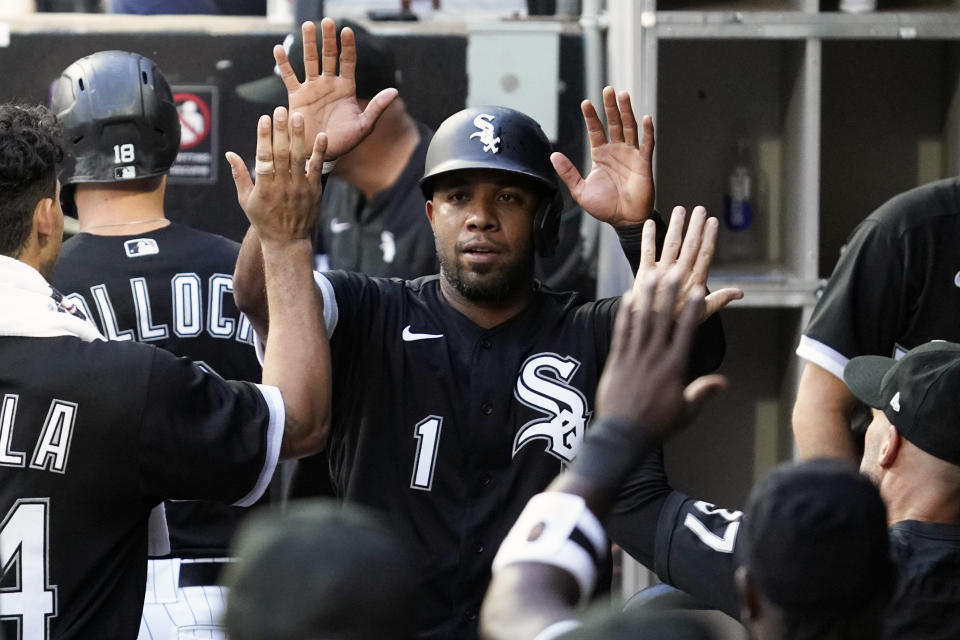 Chicago White Sox's Elvis Andrus (1) celebrates with teammates after scoring on a one-run single by Jose Abreu during the first inning of a baseball game against the Minnesota Twins in Chicago, Saturday, Sept. 3, 2022. (AP Photo/Nam Y. Huh)