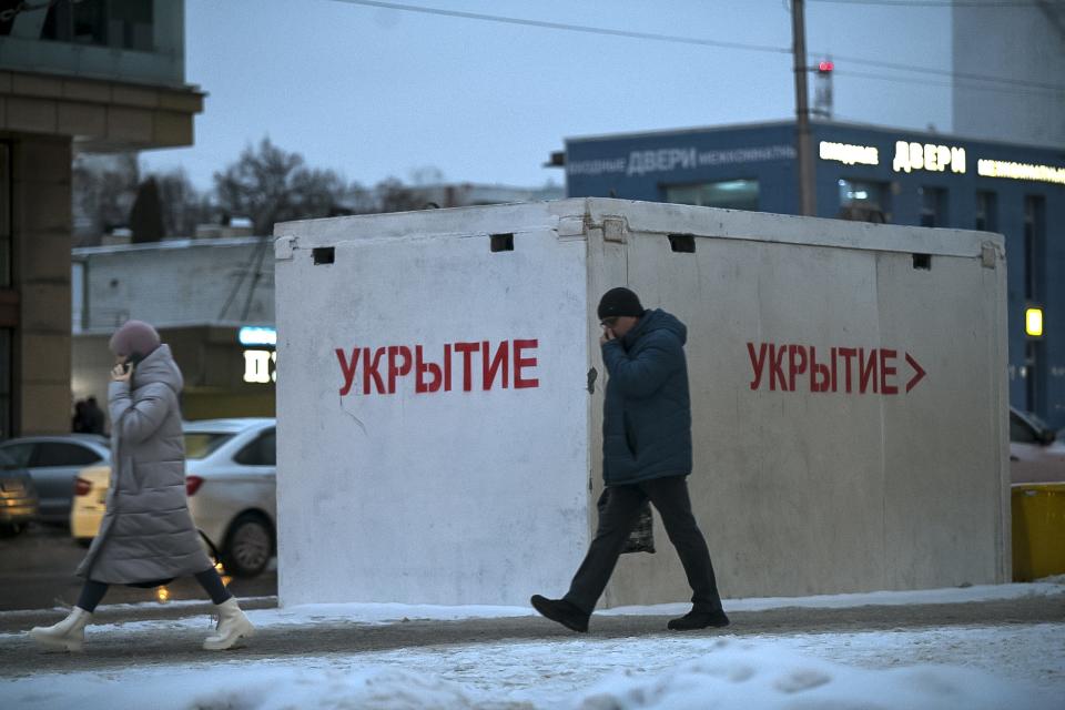 A man walks past a bus stop in Belgorod, Russia, on Thursday, Jan. 25, 2024. Hundreds of bus stops in the city near the border with Ukraine have been reinforced with blocks of concrete and sandbags to protect them from rocket strikes following the Dec. 30 attack on the city that killed 25 and injured 109. Attacks like those on Belgorod are dealing a blow to President Vladimir Putin’s attempts to reassure Russians that life in the country is largely untouched by the nearly 2-year-old conflict. (AP Photo)